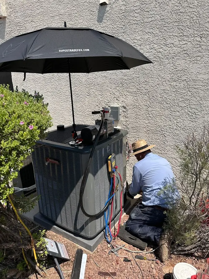 HVAC technician performing outdoor AC maintenance in Socastee